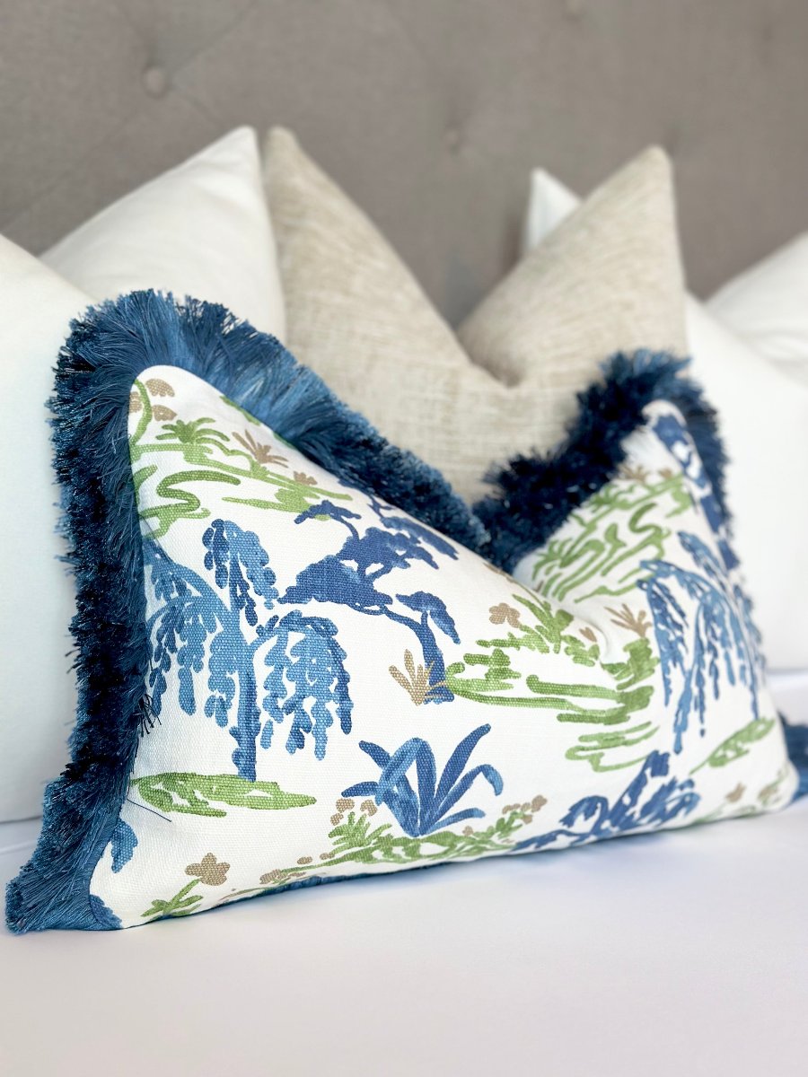 Meadow throw pillow cover with navy blue brushed fringe, made from high-quality fabric to add a stylish and vibrant accent to your home decor. Custom meadow blue green throw Pillow Cover with navy blue fringe – Luxury Designer Accent Pillow in Serene Blue and Green Hues.