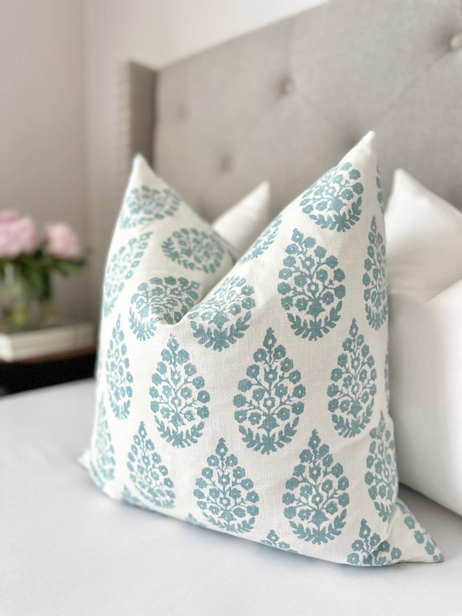 Custom-made floral pillow cover in mist blue and white linen, featuring a delicate floral motif. Luxurious, designer throw pillow is perfect for coastal and modern decor, adding elegance and sophistication to living rooms, bedrooms, or any space in need of a fresh update.