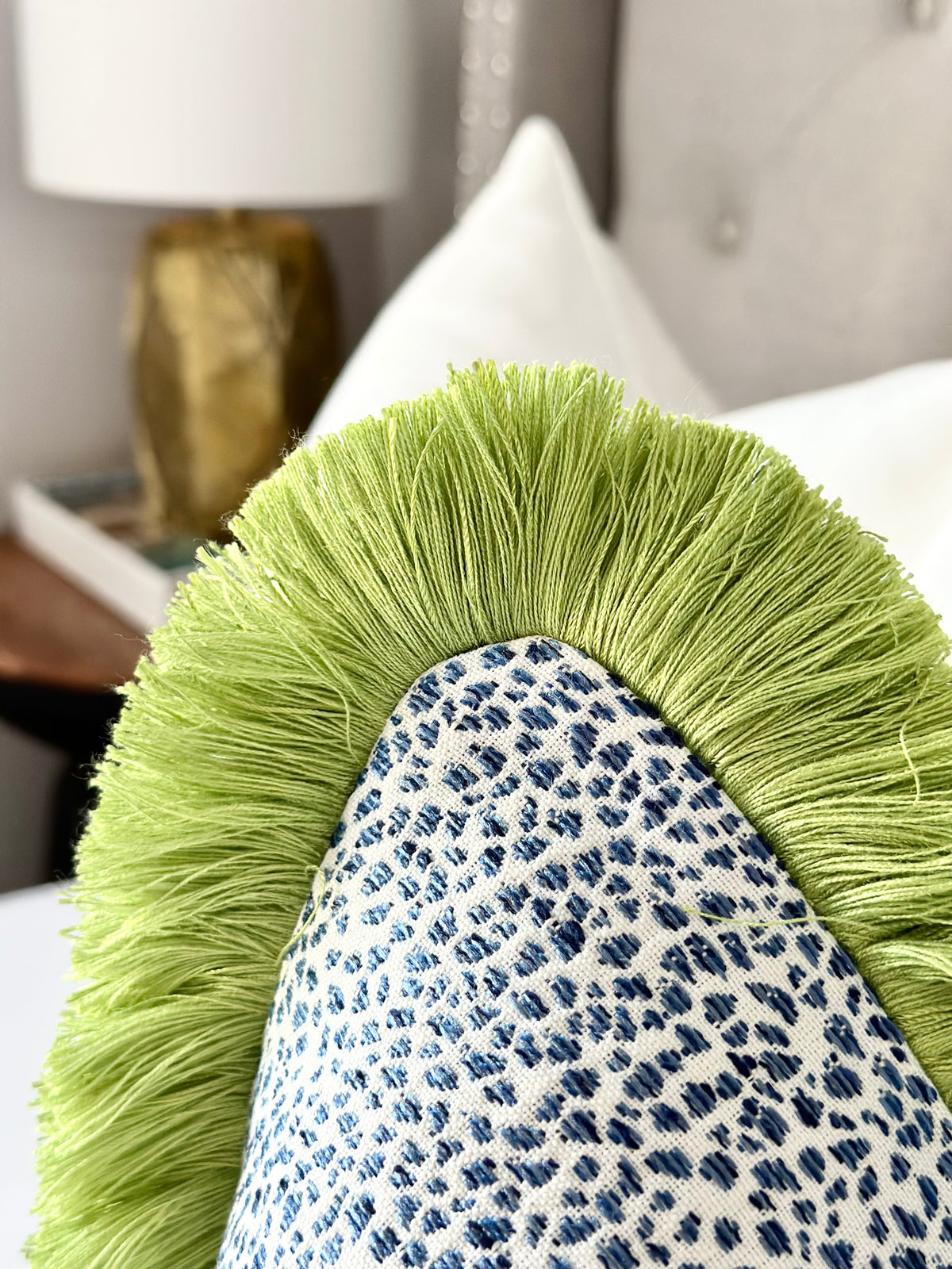 Azure spotted throw pillow cover with green brush fringe detail | CONCELLI  DECOR