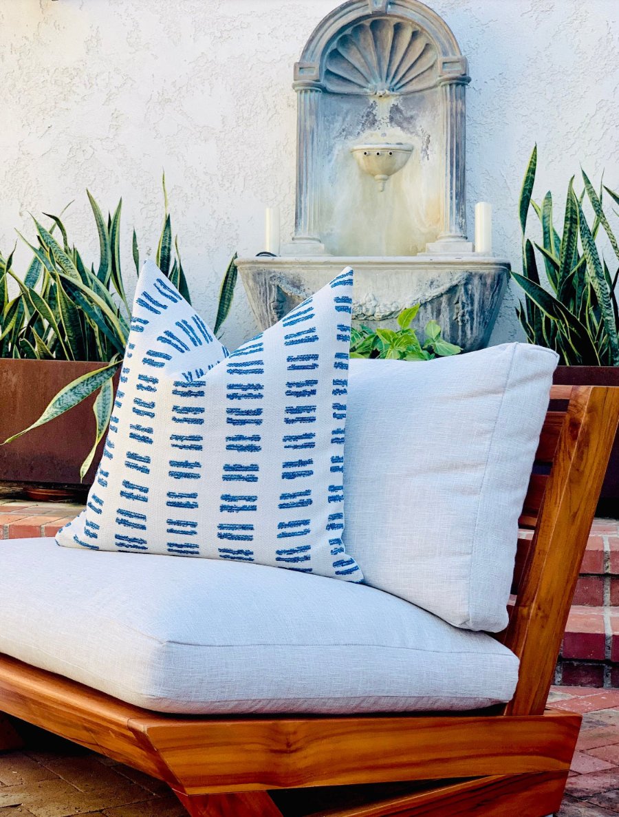 woven outdoor pillow, blue line detailing cushion, patio decor pillow, poolside throw pillow, durable outdoor fabric, custom outdoor cushion, elegant patio accessory, designer outdoor pillow, sophisticated pool area decor, premium outdoor decor