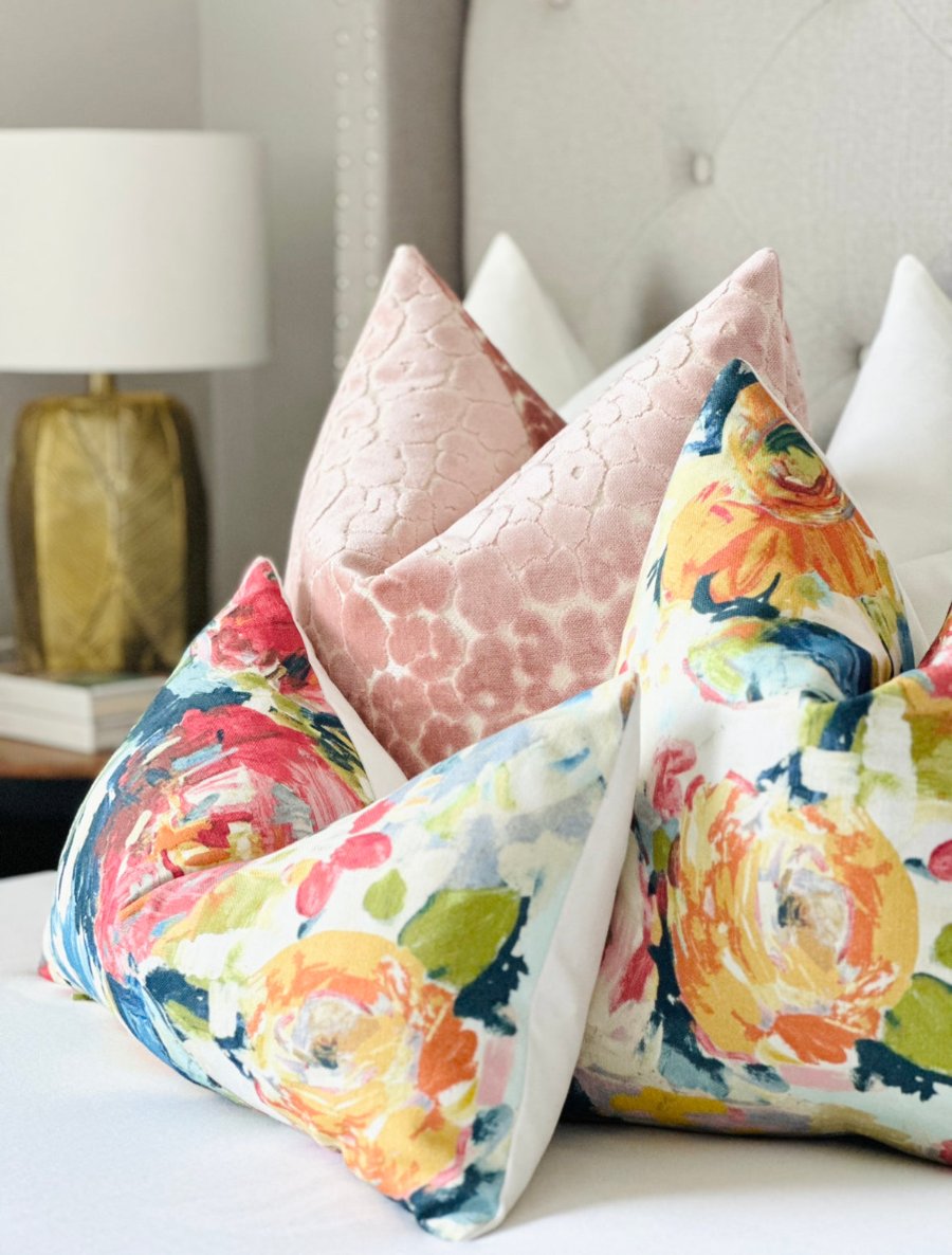 Custom-made multi-color throw pillow with a vibrant magenta peony floral print in pink, green, and blue hues. A luxurious designer pillow perfect for adding artistic charm and sophistication to modern or coastal decor. Ideal for living rooms, bedrooms, or sofas.