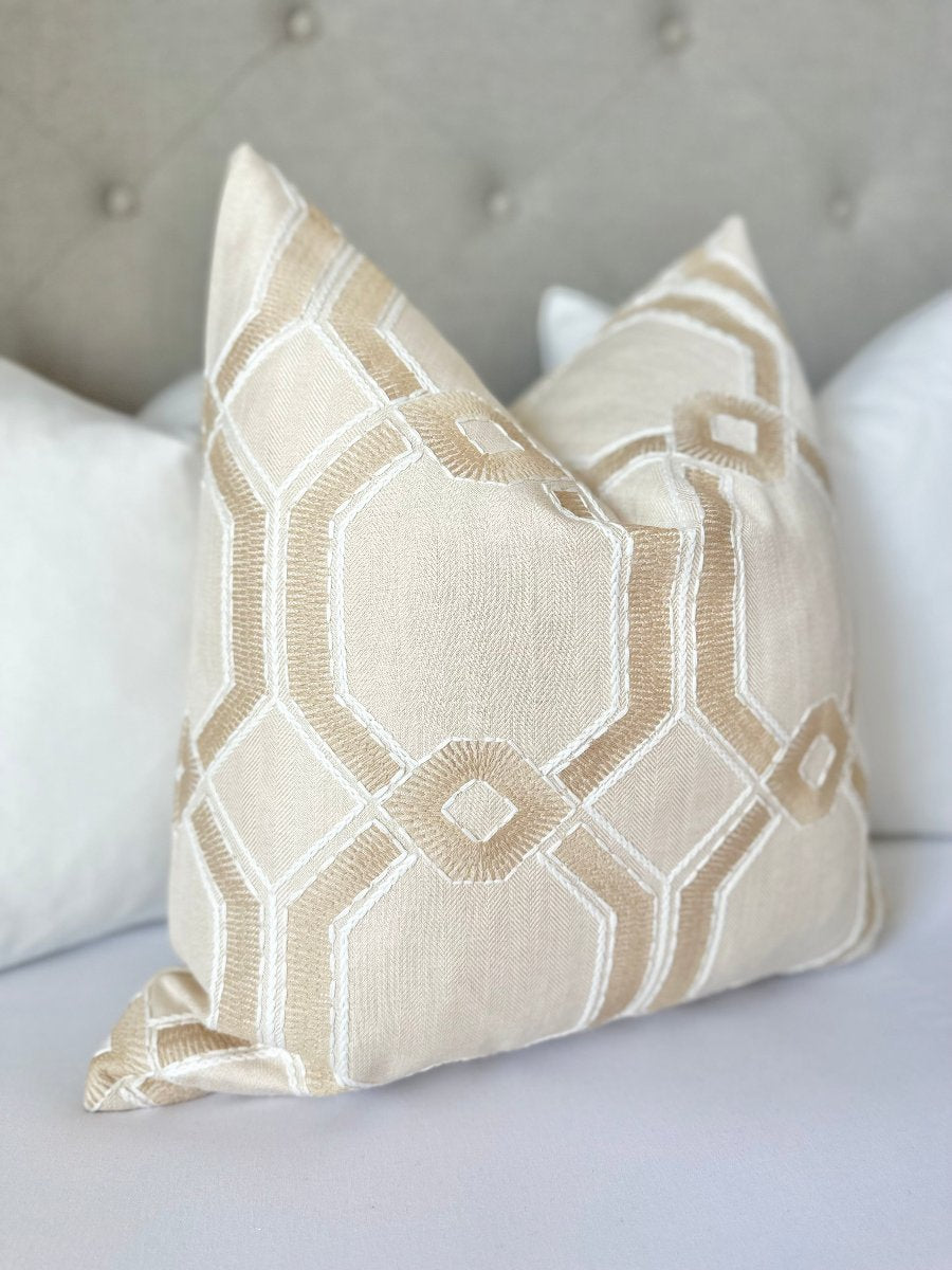 Custom-made white throw pillow cover featuring a beige embroidered pattern with chic white thread detailing. This designer pillow exudes elegance and sophistication, adding a unique, artistic touch to modern or coastal decor. Made-to-order.