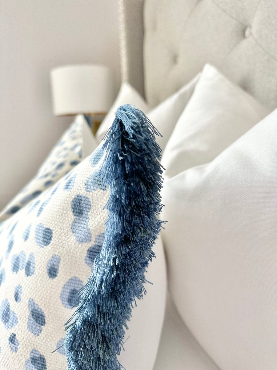 Custom-made Blue Leopard pillow cover with blue fringe detailing, featuring a bold blue leopard print on one side and white fabric on the back. This luxurious designer pillow adds exotic elegance to modern, coastal, or chinoiserie-style decor, creating a sophisticated statement piece for your home.