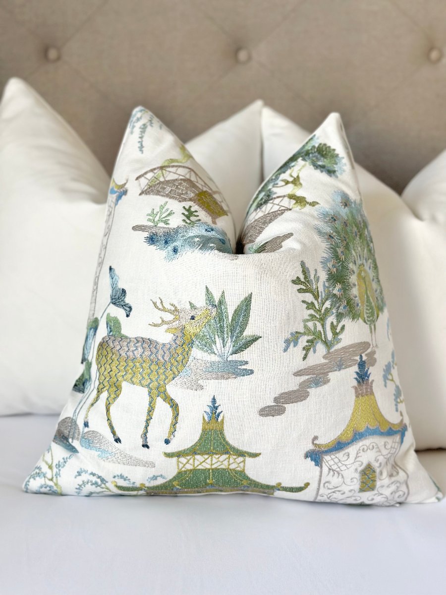 Chinoiserie-style designer throw pillow cover with deer and peacock embroidery in mist blue and lime green on white linen. Elegant, vibrant, and intricate home decor accent. Chinoiserie pillow, designer throw pillow, embroidered pillow