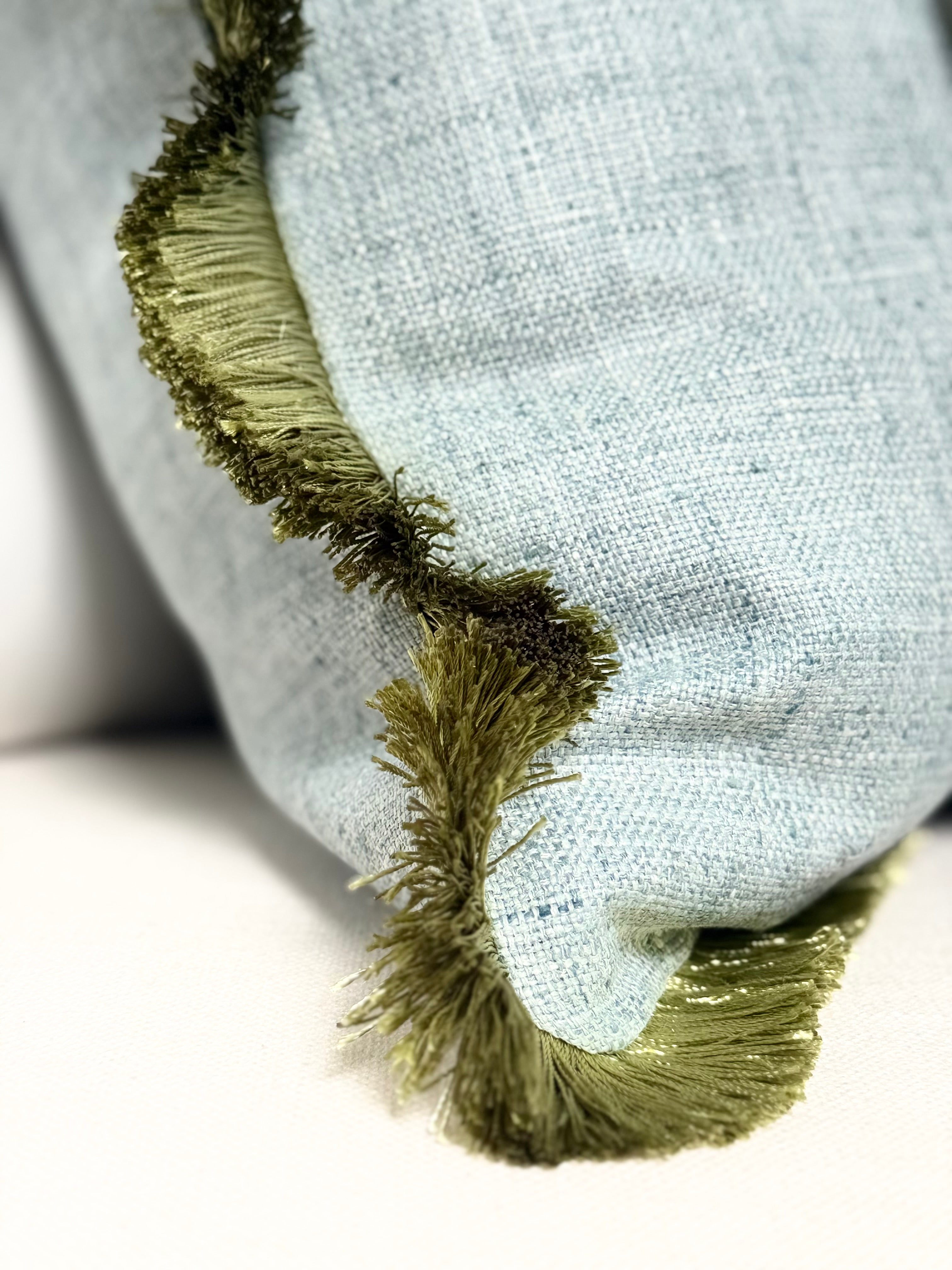 Mist blue cotton pillow green fringe detail