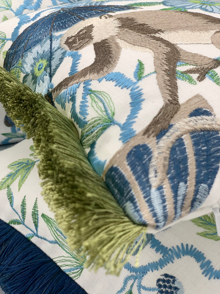 Embroidered Chinoiserie pillow with blue fringe detail