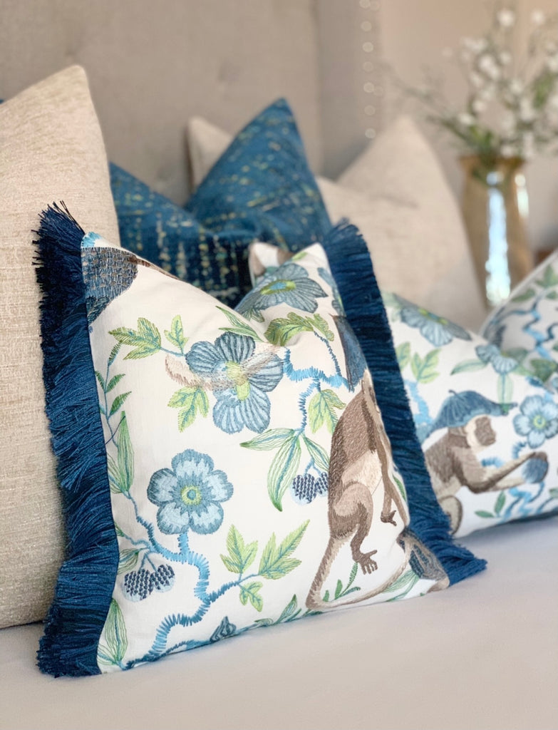 Embroidered Chinoiserie pillow with blue fringe detail